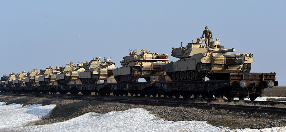 Daniel Mihailescu/AFP. US Army personnel offload military equipment at the Mihail Kogalniceanu Air Base near Constanta in Romania on February 14, 2017