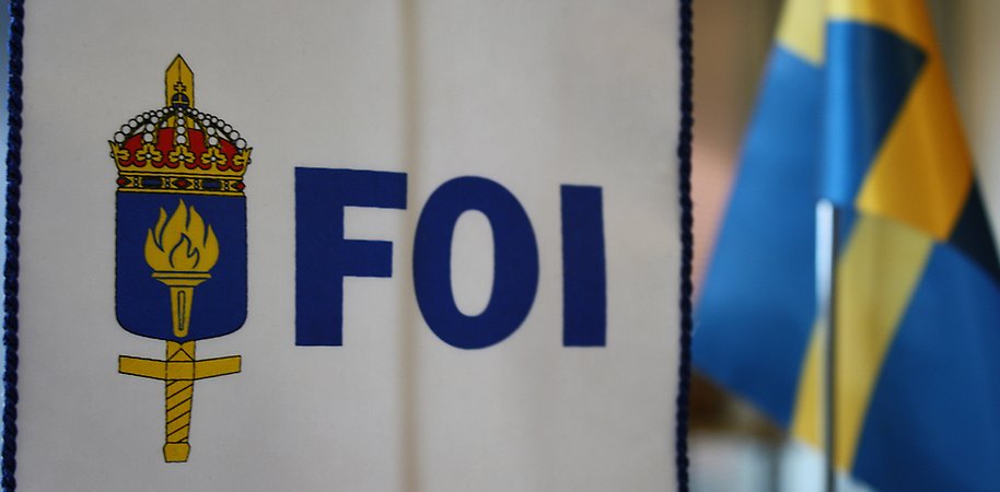 FOI:s logotyp och svensk flagga